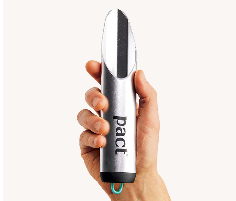 Hand holding the PACT One Kit outdoor bathroom tool, designed for digging catholes and practicing Leave No Trace.
