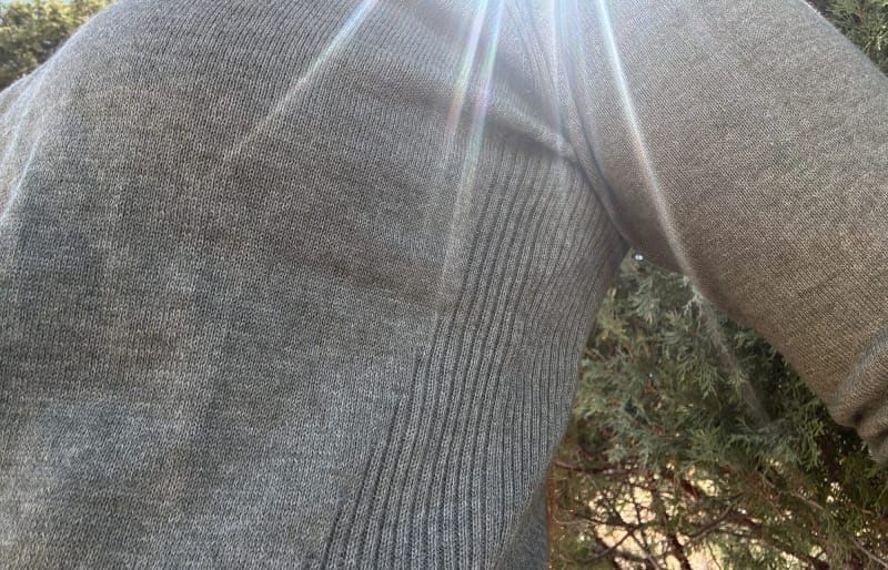  Side view of PAKA COOLPLUS Crew showing textured breathable knit zones under the arm and along the side