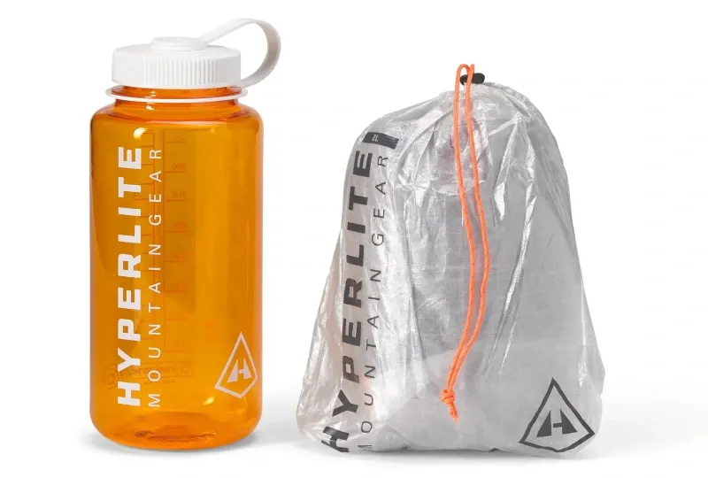 Packed Hyperlite Mountain Gear Bug Bivy next to Nalgene bottle showing ultralight, compact size for backpacking