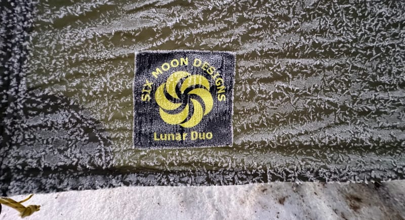 Close-up of frost-covered Six Moon Designs Lunar Duo tent fabric in freezing weather conditions.