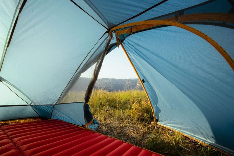 Morning canyon view from inside the Zorali Summit-Seeker 2P Tent with mesh walls and open door