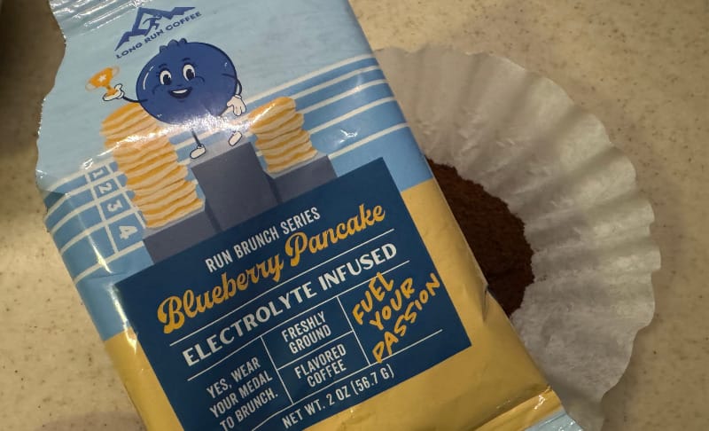  Long Run Coffee Blueberry Pancake electrolyte-infused ground coffee in a filter, perfect for trail-ready energy.