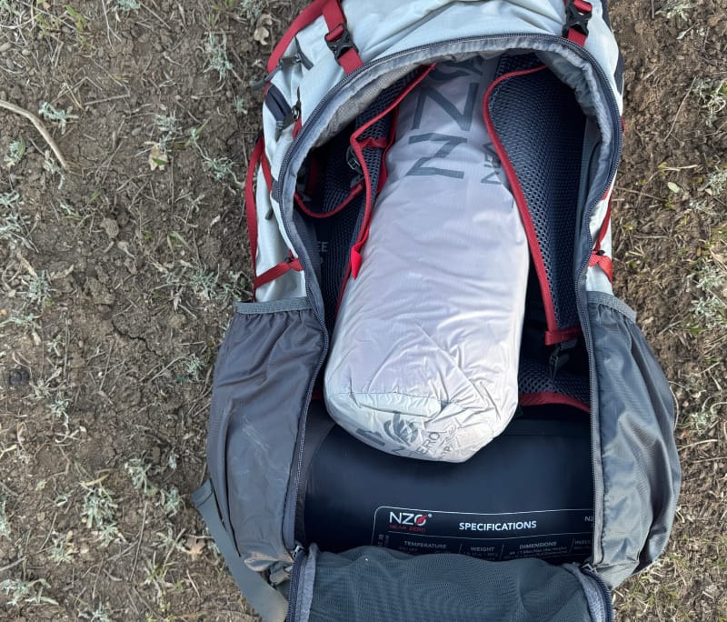  Open Dean 60 backpack showing spacious main compartment with gear inside, including the Near Zero tent bag.