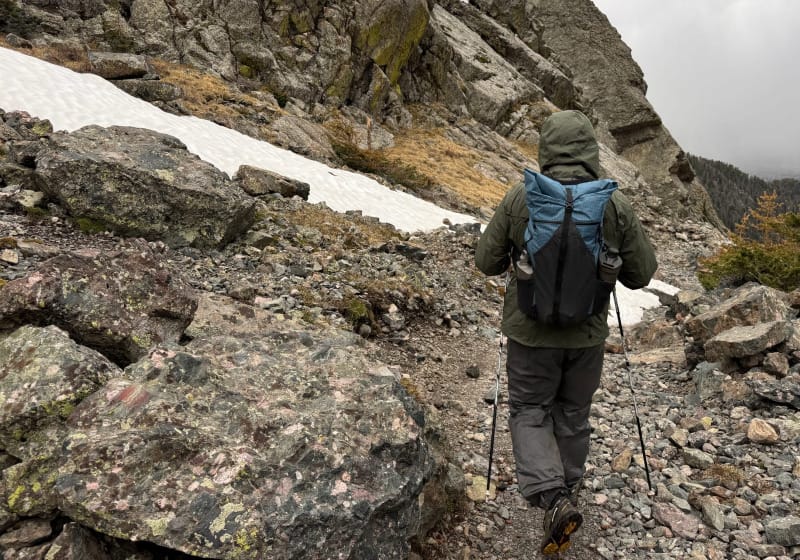  Hiker wearing the Exotic Pack Co Custom FKP ultralight backpack in the snowy Sangre de Cristo Mountains.