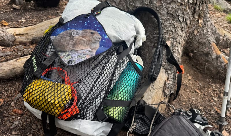a kula cloth snapped on a hyperlite backpack