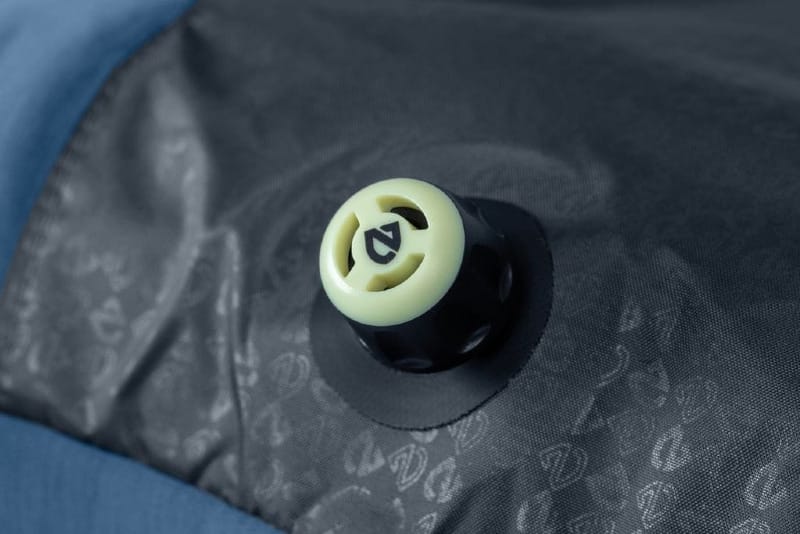 Close-up of NEMO Equipment’s Laylow™ multi-function valve on a sleeping pad, showing the detail and texture of the material.