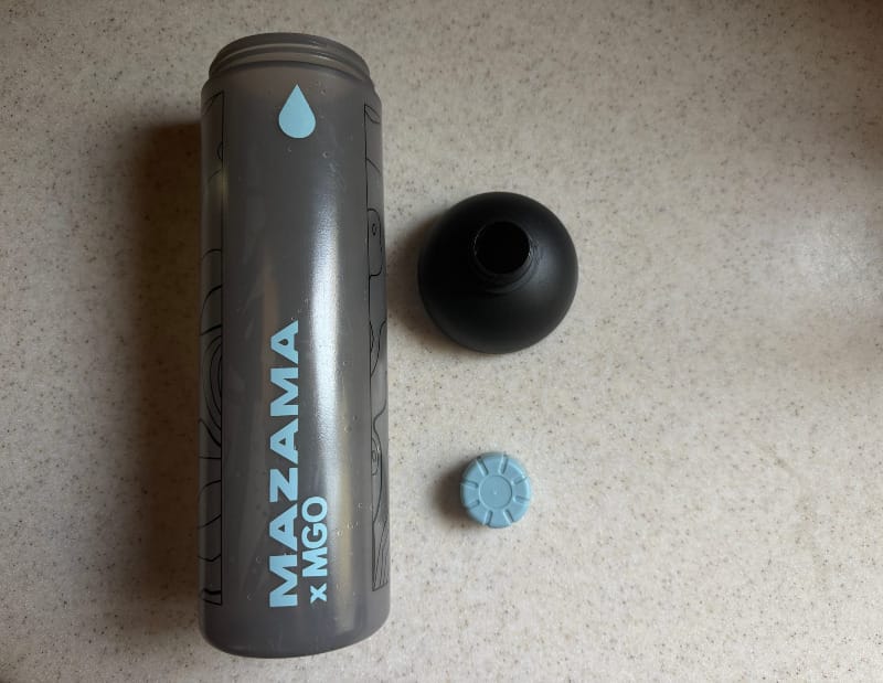  Mazama Designs M!GO water bottle with cap and wide-mouth lid displayed on a counter.