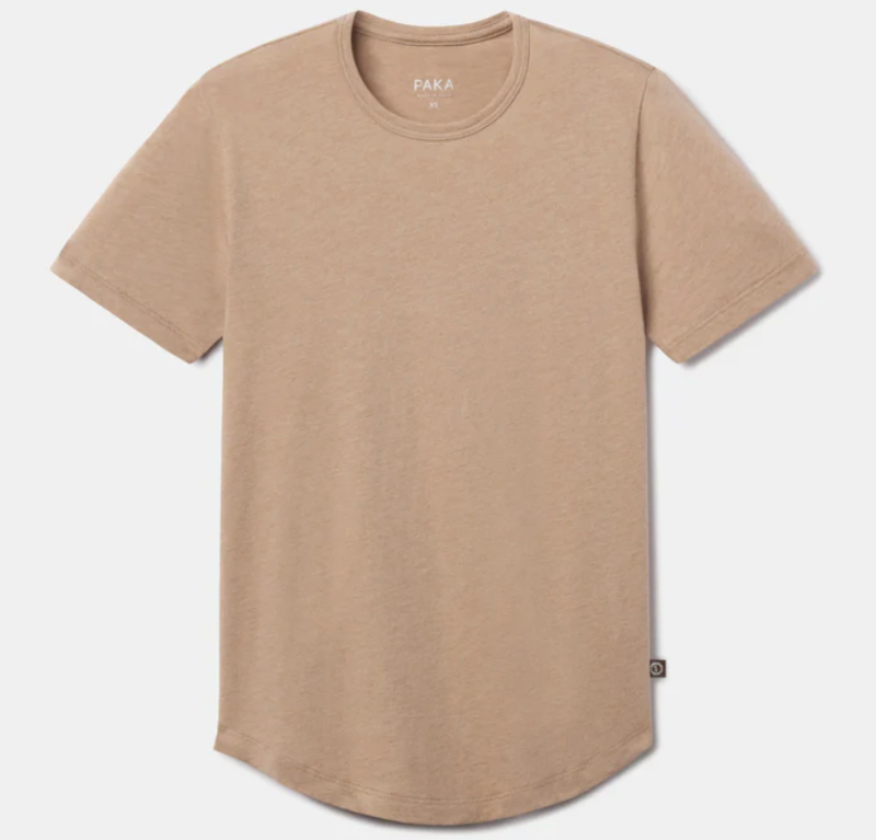 PAKA Essential Tee in tan color, laid flat to show minimalist design and curved hem