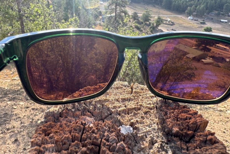 View through FKT Gear Beaten Path Sunglasses showing non polarized lens clarity while overlooking a forested valley.