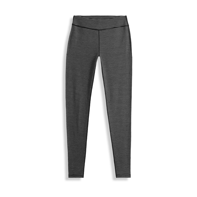 Black and white striped merino wool base layer leggings for cold-weather hiking and autumn outdoor activities.
