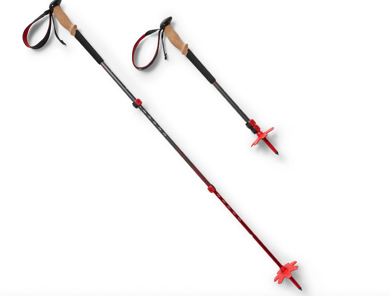 Pair of collapsible red and black trekking poles with cork handles.