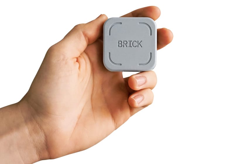Close-up of the Brick device, a minimalist tool that disables smartphone distractions for mindful hiking and backpacking.