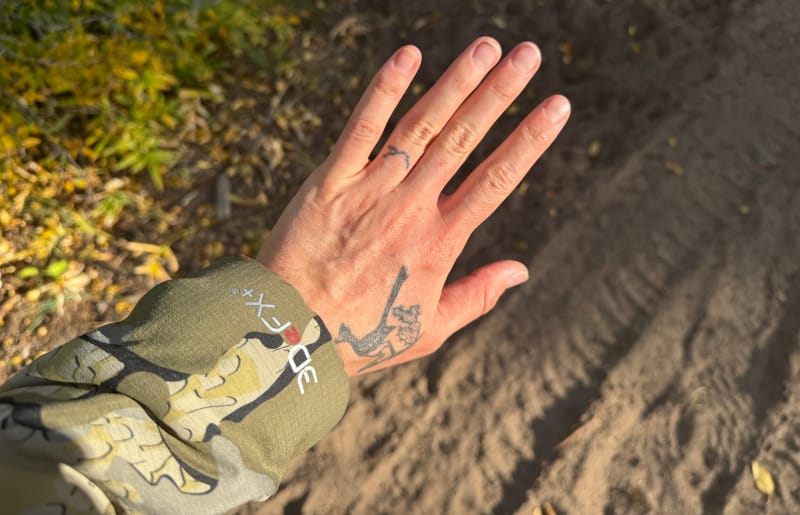 Close-up of KUIU Kenai Hooded Jacket sleeve showing 3DeFX+ insulation logo during a hike in the San Juan Mountains.