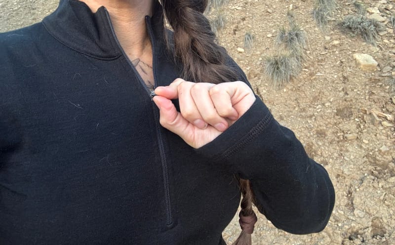 Close-up of the Arms of Andes Alpaca Wool Half-Zip zipper and flat seam construction, emphasizing durable stitching and technical comfort design.