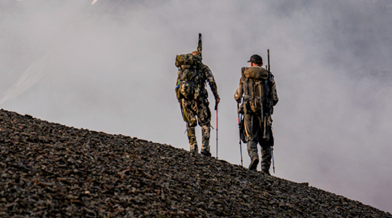 KUIU hunting jackets, pants, and ultralight packs promoting the 2025 KUIU Biggest Sale of the Year, featuring up to 50% off and free shipping offers.