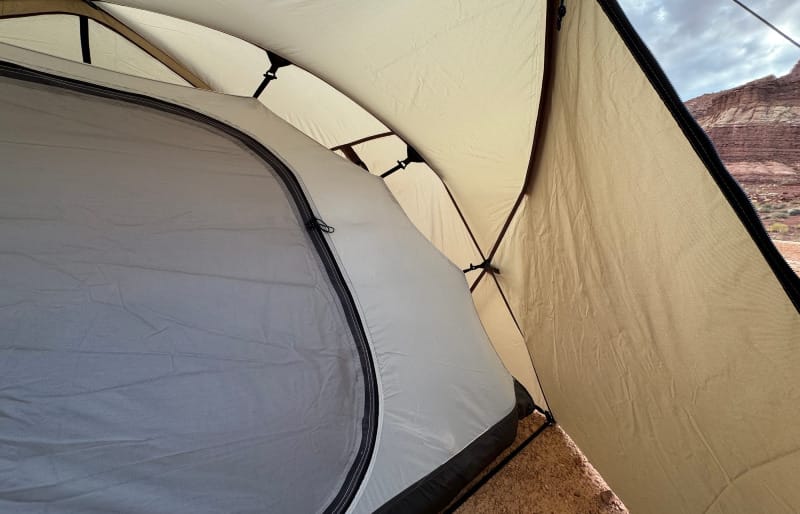 Snow Peak Minute Dome Pro Air 1 interior showing mesh storage pockets beside a down sleeping bag.