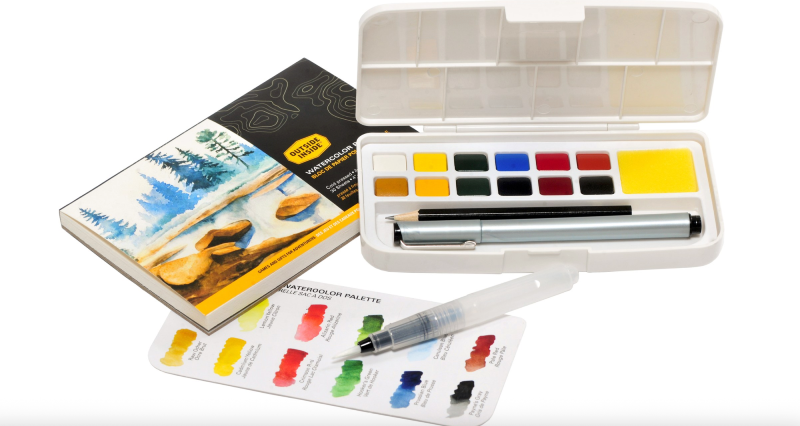 watercolor paint kit for backpacking in ultralight packaging stock image with art colors on full display.