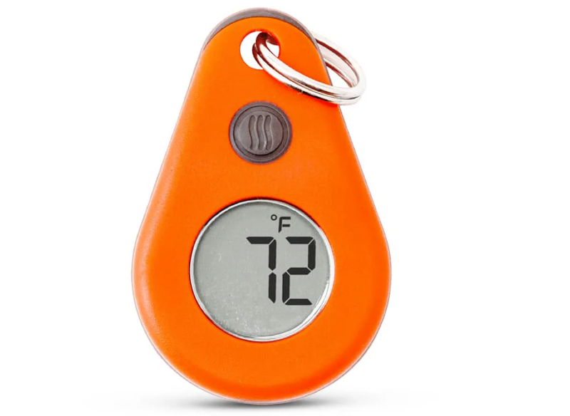 Close-up of an orange ThermoWorks zipper-pull thermometer showing a digital temperature reading of 72 degrees Fahrenheit.