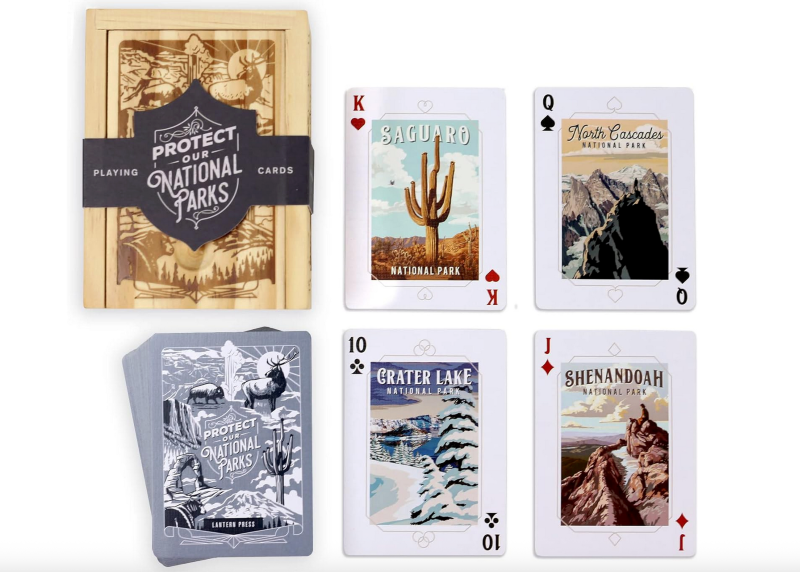 Deck of “Protect Our National Parks” playing cards with park-themed artwork and wooden storage box.