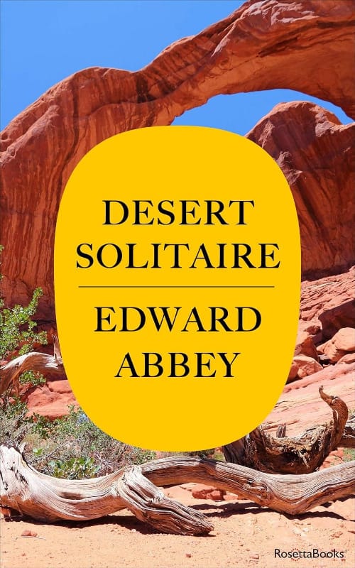 Book cover of Desert Solitaire by Edward Abbey, featuring red rock landscapes and twisted juniper branches.