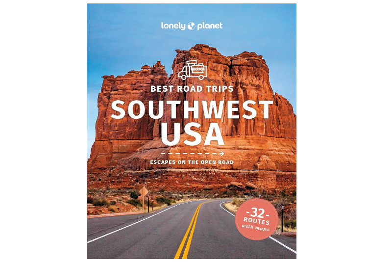 Cover of a Southwest USA road trip guidebook featuring a paved road leading toward tall red rock formations in the desert.