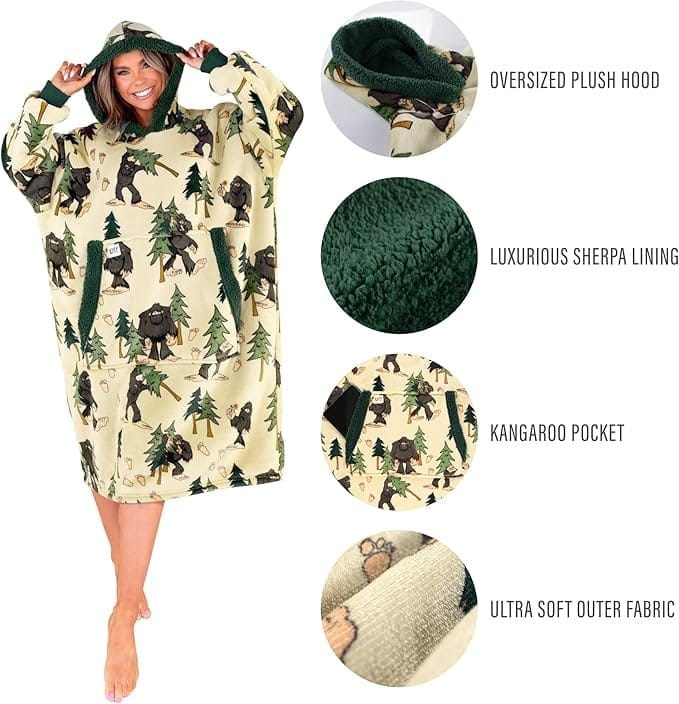 Woman wearing an oversized sherpa-lined hoodie with Bigfoot and tree print, featuring plush hood, kangaroo pocket, and soft fabric details.