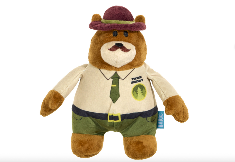 Plush dog toy shaped like a park ranger bear wearing a ranger uniform and hat.