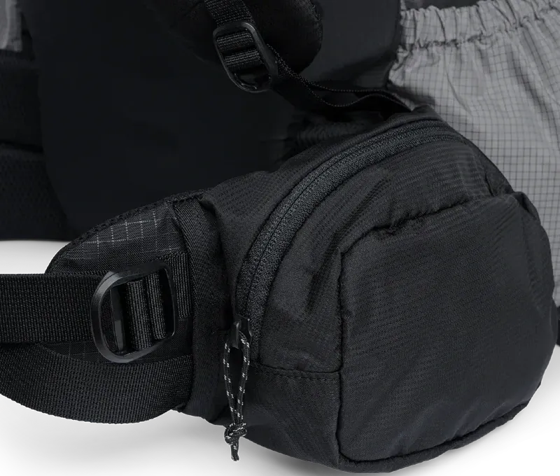 Close-up of the Outdoor Vitals Shadowlight Carbon 60 hipbelt pocket, highlighting large zippered storage on the backpack.