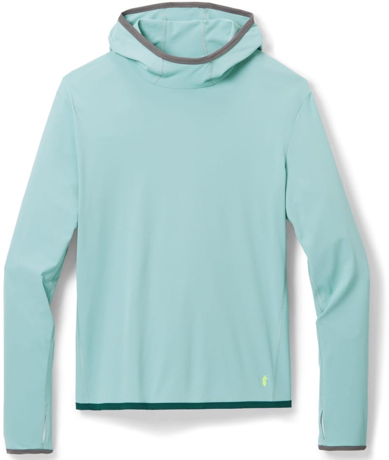 Cotopaxi Sombra Sun Hoodie in light blue, featuring a lightweight long-sleeve sun hoodie with an integrated hood for sun protection while hiking and backpacking.