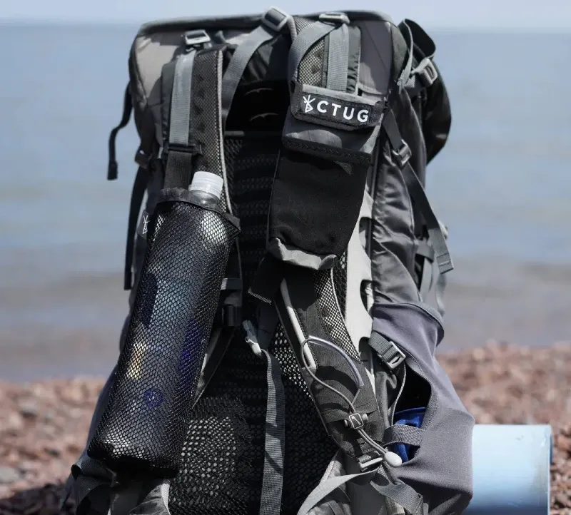 Chicken Tramper Ultralight Gear shoulder strap pocket attached to an ultralight backpack, holding small essentials for easy access while hiking.