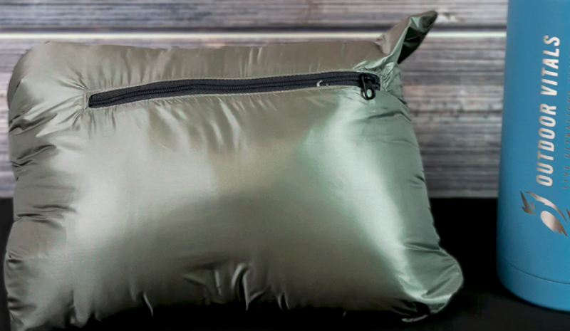 Outdoor Vitals NovaPro Down Jacket packed into its stuff sack, showing how compact and lightweight the down jacket is for backpacking and hiking