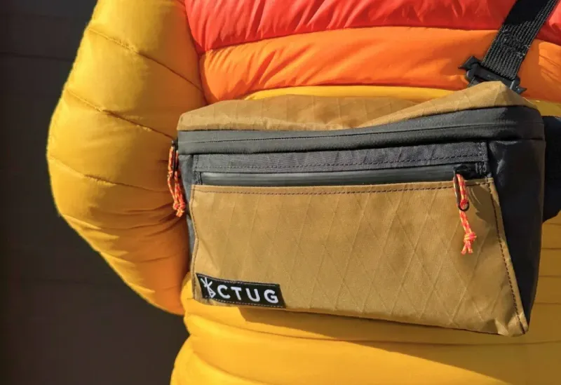 Chicken Tramper Ultralight Gear hip pack worn on trail, featuring durable ultralight fabric and minimalist pocket layout.