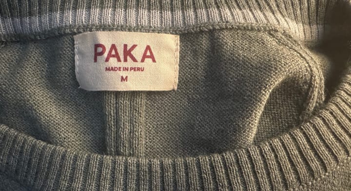  Interior neckline and fabric texture of the PAKA Ultralight COOLPLUS Crew with visible tag marked "Made in Peru"