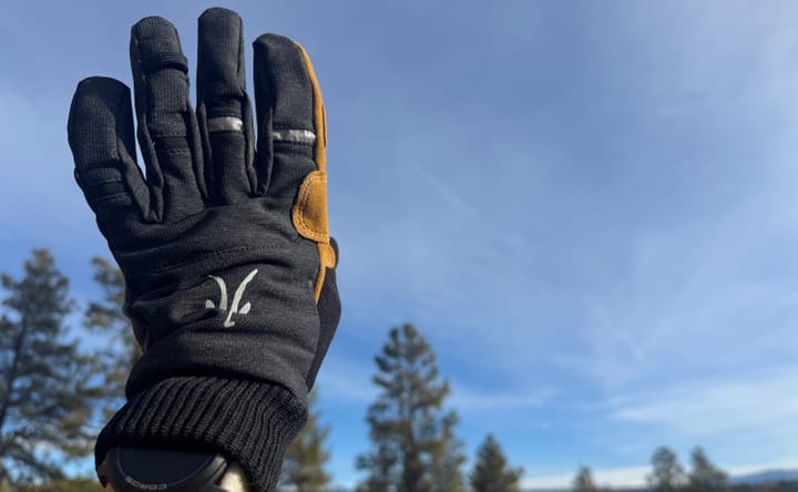 Ibex Kilometer Gloves worn while hiking in cold weather showing flexible fit and leather palm reinforcement